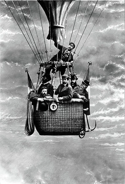 Balloon ride before 1900, photograph made in studio in front of painted sky decoration (photo)
