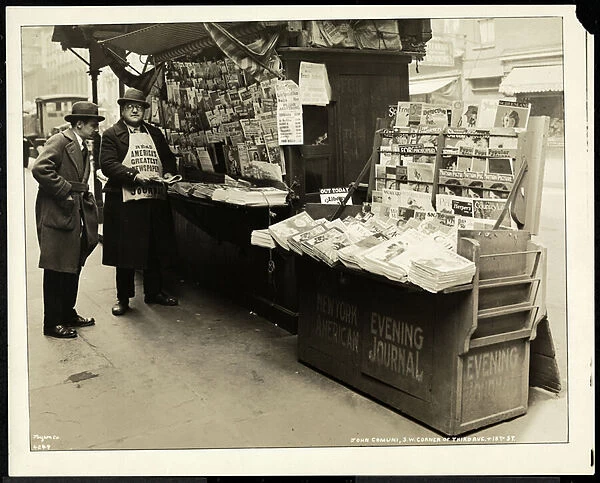 Blind news dealer, John Comuni, at his stand at 3rd Avenue and 18th Street, New York