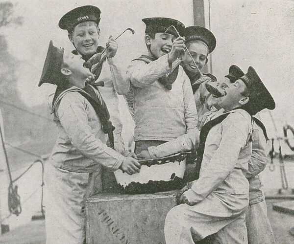 Boys on board the Royal Navy training ship HMS Stork trying their Christmas pudding mixture (b  /  w photo)