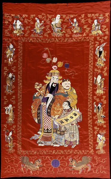 A Chinese embroidered red satin hanging depicting a figure with a ru-i and two attendants