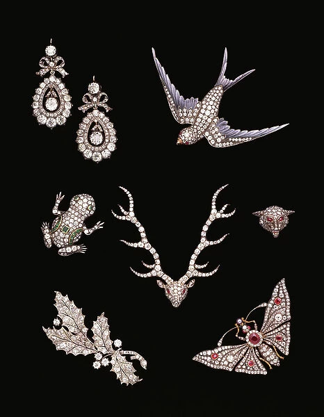 A collection of Victorian diamond brooches including a diamond and enamel swallow in flight, a diamond-emerald frog, a diamond-ruby stag's head, a pave-set fox mask, a diamond holly sprig and a ruby-diamond tremblant butterfly
