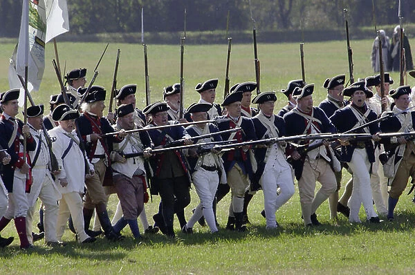 Continental Army reenactors advance at Yorktown battlefield, Virginia