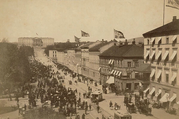 Crowd of people in the street Karl Johan, Oslo; background Royal Palace