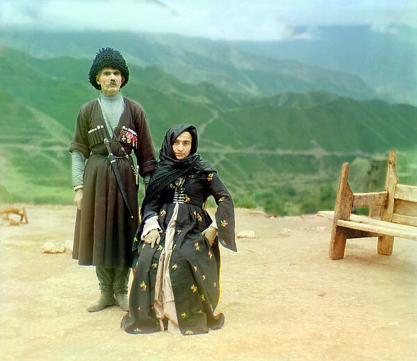 Dagestani types - a man with medals and a dagger and a woman in black dress