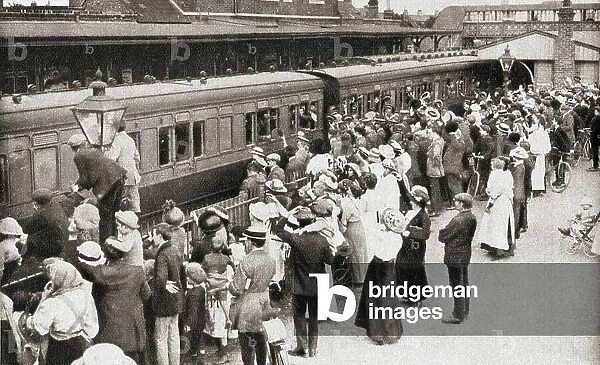 A draft of men board the train in Hounslow, England en route for the front, which in 1914 was Belgium, from The Pageant of the Century, pub.1934