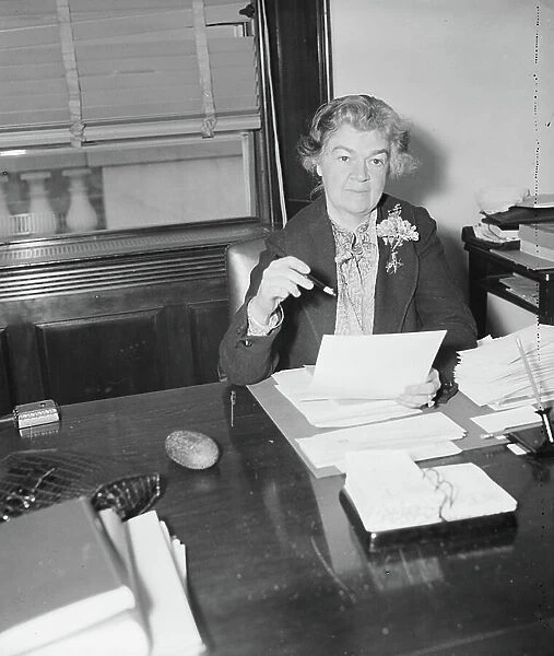 Edith Nourse Rogers, First Woman Elected to Congress from Massachusetts, Portrait Sitting at Desk, Washington DC, USA, February 1936 (b / w photo)