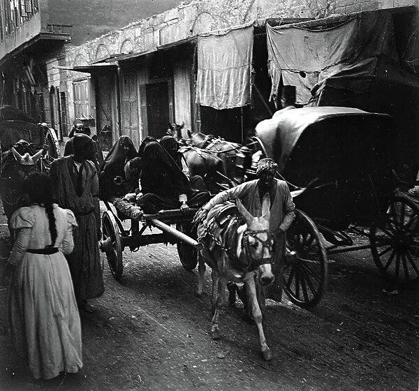 Egypt, Cairo: Old Quarter, Street crowded with carts carrying veiled women, animated view, 1899