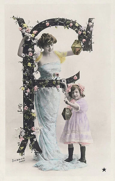 F: Capital letter decorated with flowers, a woman wearing a long cloth and a girl holding a lantern. 1907 (photograph)