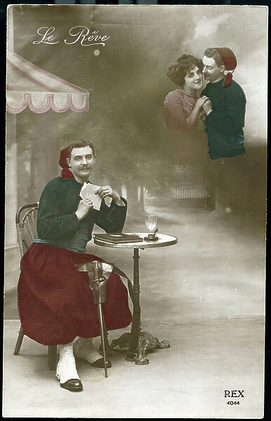 First World War: France, An Algerian Zouave reading a letter of his fiance sitting at a bistro table near the front, 1915