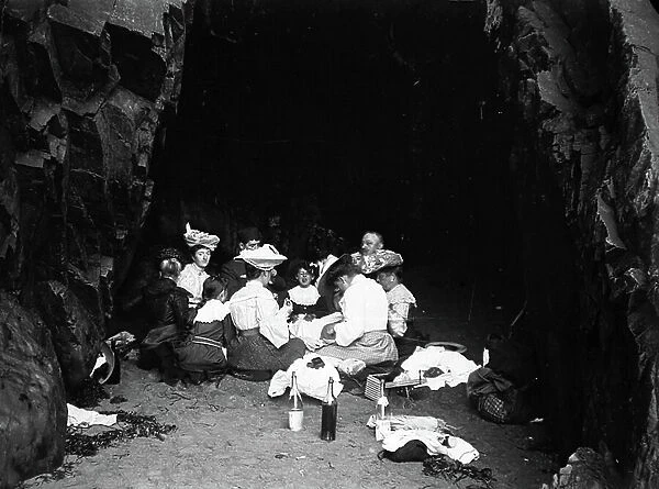 France, Brittany, Cotes-d'Armor (22), Stables sur Mer (Etables-sur-Mer): August 1904, excursion from Saint-Quay-Portrieux to Etable sur mer, tourists take shelter in a cave on Etable beach for lunch, 1904