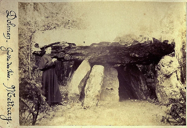 France, Centre, Indre-et-Loire (37): a priest next to the Dolmen of the Grotte aux Fees (Dolmen de Mettray) to Saint Antoine du Rocher (Saint-Antoine-du-Rocher), 1880
