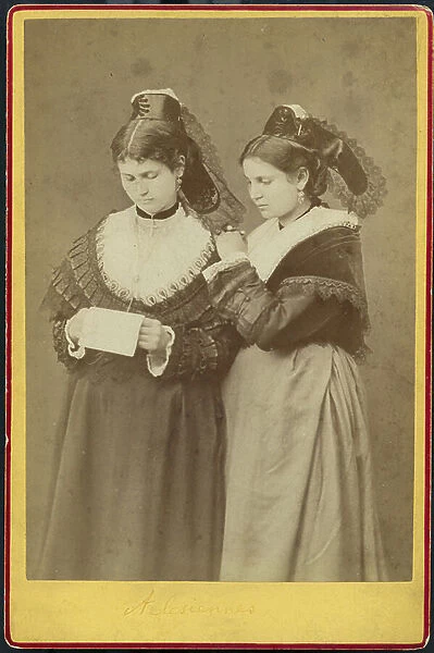 France, Provence-Alpes-Cote d'Azur, Bouches-du-Rhone (13), Arles: Two young Arlesiennes in local clothes read a letter, 1870