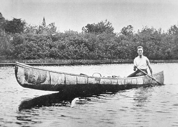 Franklin D. Roosevelt (1882-1945) paddling a birch canoe at Campobello Island