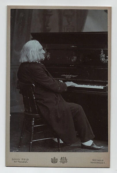Franz Liszt playing the piano (1811-1886) (1886, photograph)