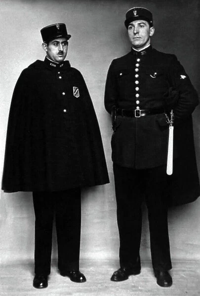 two French gendarmes with white stick, cape and kepi, 10's