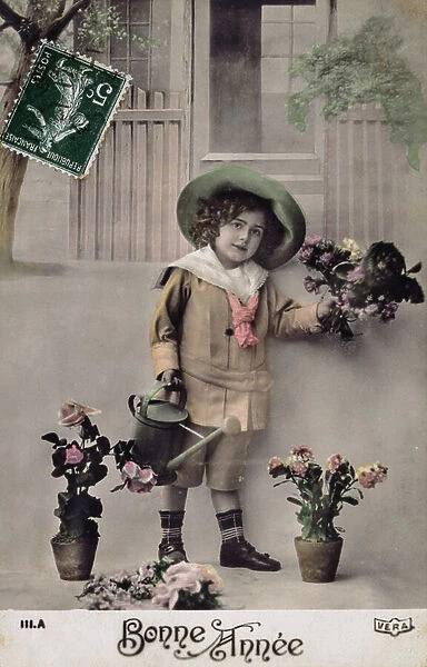 French postcard depicting a young boy with floral decorations, 1900 (postcard)