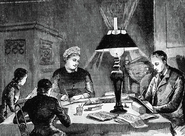 A German family seated round the table on a winter evening, 1850