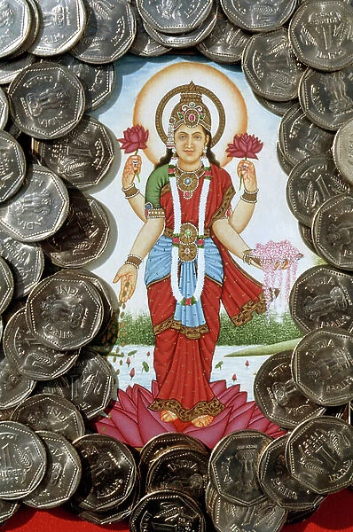 Goddess Lakshmi and One Rupees Coins