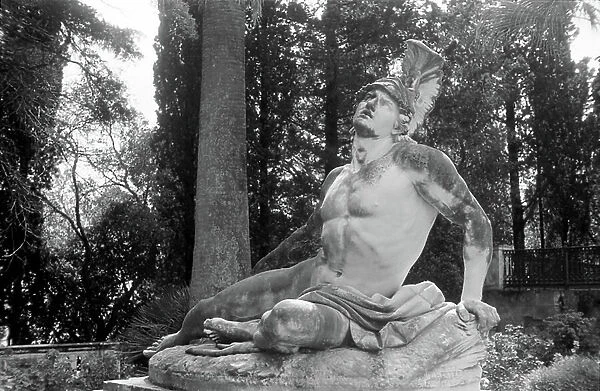 Greece - The statue of Achilles in the garden of Achilleion in Corfu, Greece, 1950s. Sculpture of Achill at the garden of the Achilleion museum at Corfu, Greece, 1950s