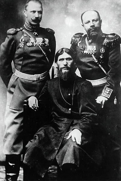 Grigori yefimovich rasputin (seated) with two russian officers, 1890s