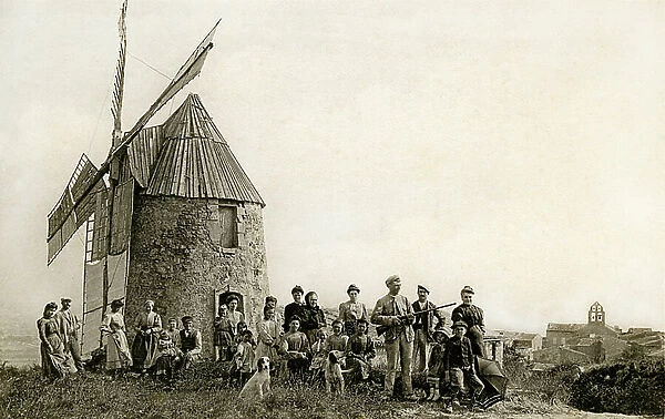 Group of villagers in front of a windmill in the village of Mireval-Lauragais, around 1910 (postcard)