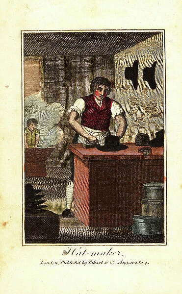 Hat maker ironing the brim of a hat made from beaver fur. In the background, an apprentice works the felt in a battery (hot-water kettle). Handcoloured woodcut engraving from The Book of English Trades and Library of the Useful Arts