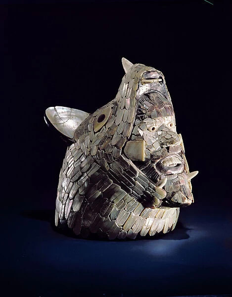 Head of an animal with a human head in the open jaws, found at Tula, Hidalgo, Mexico