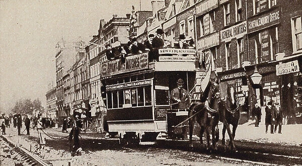 Horse-drawn tram passing electrification works for the line, 1902 (b / w photo)