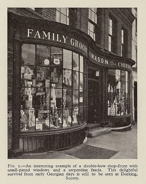 An interesting example of a double-bow shop-front with small-paned windows and a serpentine fascia (b / w photo)