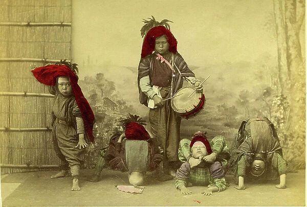 Japan: street acrobats in their traditional dress, 1875 - albumin paper enhanced by watercolor