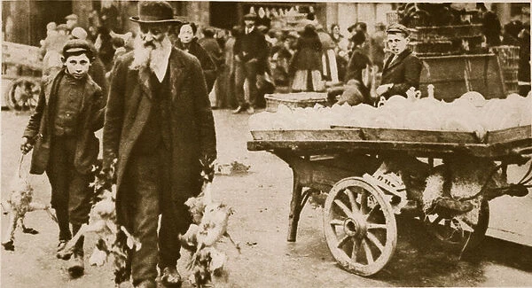 An Jewish old man and his grandson carrying some fowls from Wentworth Street