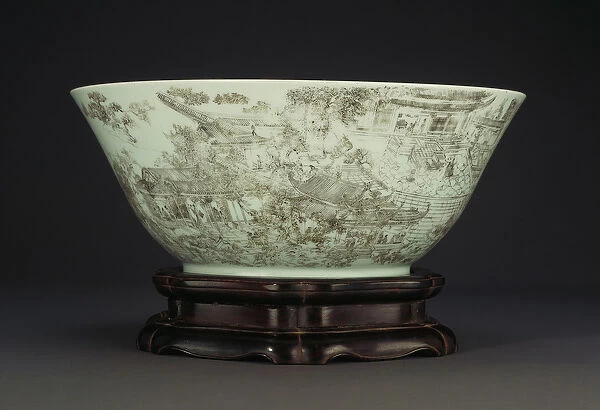 A large incised porcelain bowl depicting a continuous scene of ladies in the palace