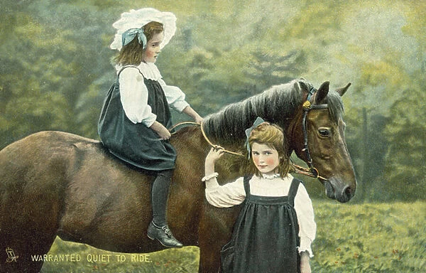 Two little girls on a horse (colour photo)