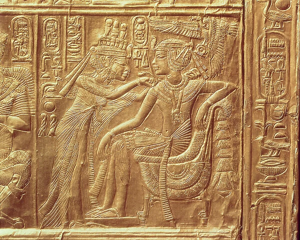 Detail from the little shrine of Tutankhamun depicting the Queen fastening a necklace