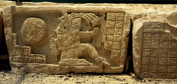 Low relief of a ball game player, the ball, and the glyphs giving a description