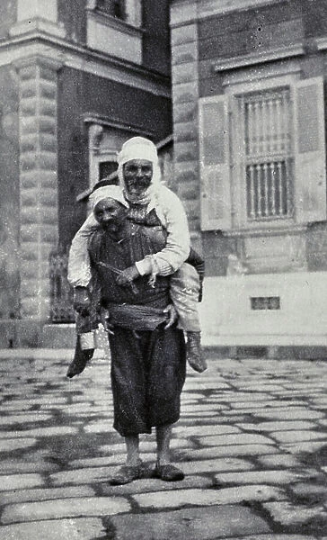 A man carries an elder, Izmir, 1904 (print on double-weight paper)