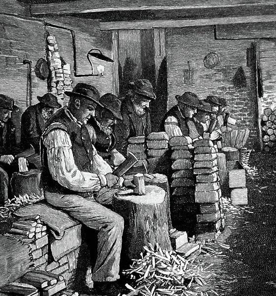 Men employed chopping firewood in the casual ward of a London workhouse, 1895