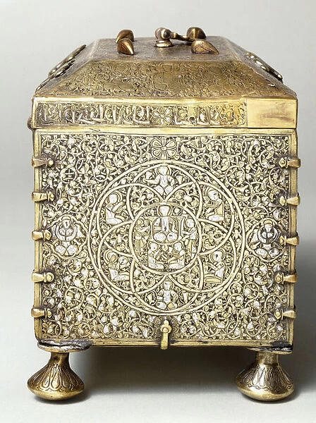 A Mesopotamian silver inlaid brass casket, with dials for a combination lock (side view)