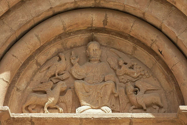 Parish church (Esglesia Sant Pere d'Or). Exterior. South portal. Arnau Cadell. The tympanum. Romanesque. 14th century
