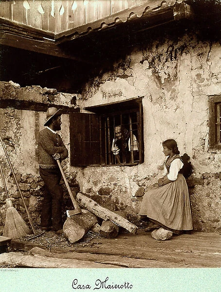 Three people photographed at Casa Maierotto, Cortina