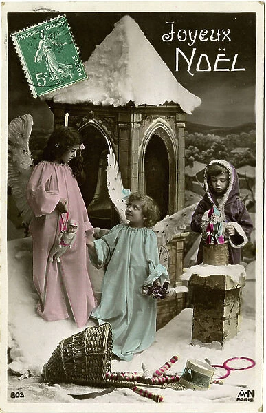 Postcard, Christmas greetings: Angels in the snow with a hood and toys. Begin the 20th century