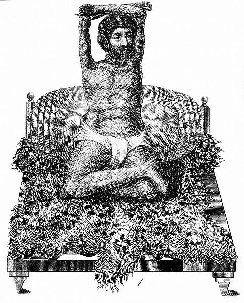 Purana Puri, a Fakir or holy man, whose mode of devotional discipline was the elevation of his arms above his head. His arms lost mass and shrank as a consequence