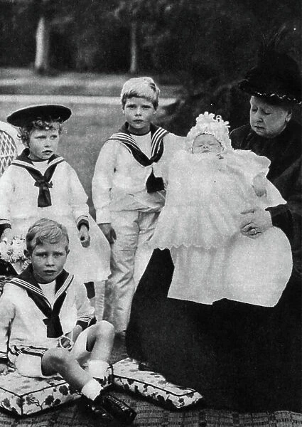 Queen Victoria sitting with her Great Grandchildren