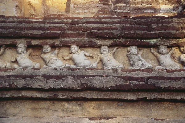 Relief depicting dwarves on the exterior of the Thivanka Image House (stone)