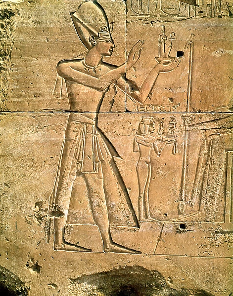 Relief depicting Tuthmosis III (c. 1479-1425 BC) making an offering to a seated god