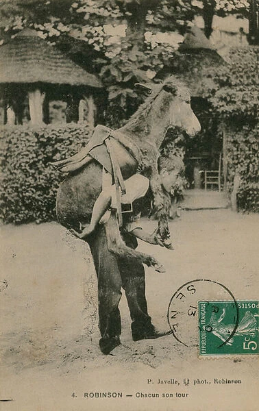 Robinson, Chacun don tour. Young man carrying donkey (b  /  w photo)