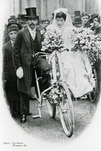 Roman Catholic couple leaving Notre Dame de France, Leicester Square, on bicycles (photo)