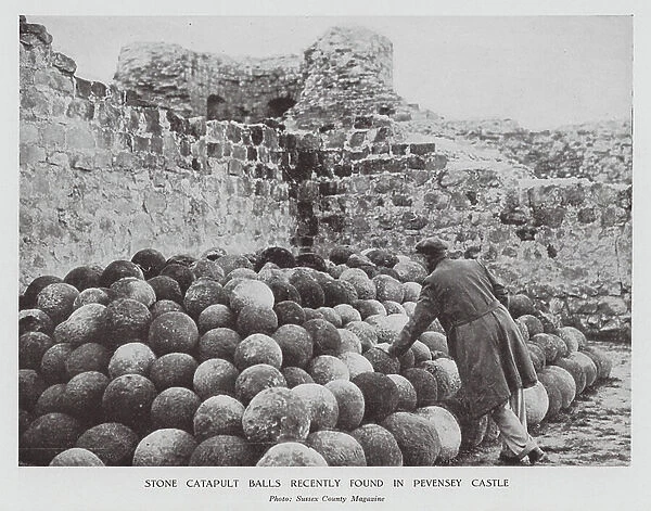 Stone catapult balls found in Pevensey Castle, Sussex (b / w photo)