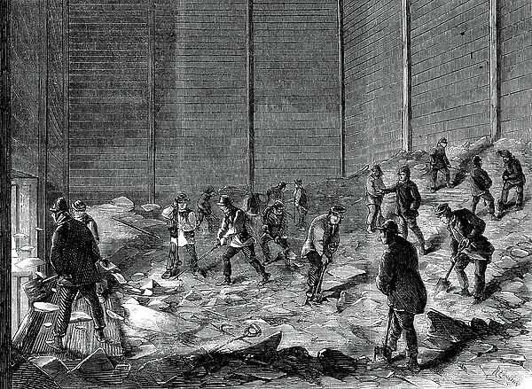 Storing ice in insulated sheds at Charles's Ice Store, Chelsea, London. For use in summer. Wood engraving 1861