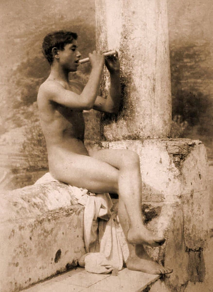 Study of a boy playing a flute, c. 1900 (sepia photo)